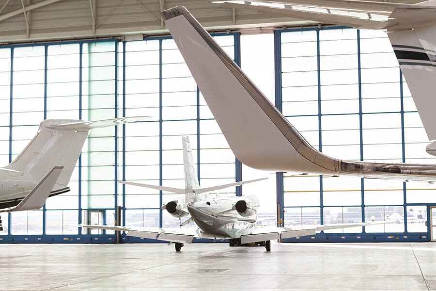 SmallPassengerAirplaneLeavingBrightHangar